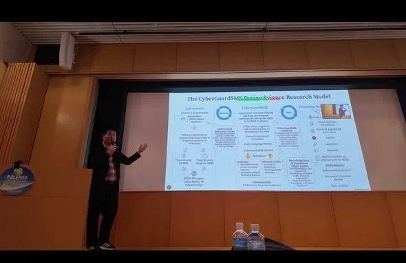 Charnsak Srisawatsakul presents the CyberGuardSME research model during NLPIR 2025